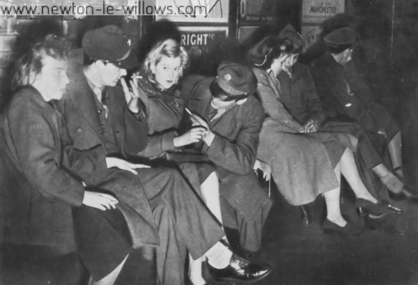 G.I.s From Burtonwood and Their Girls Wait on Warrington Station for the Manchester Train Many Americans prefer to find their pleasures in other places than Warrington. At week-ends there is an exodus of G.I.s with, or without, their girls. Some girls come from Liverpool. Some from Manchester. Some from even further afield.